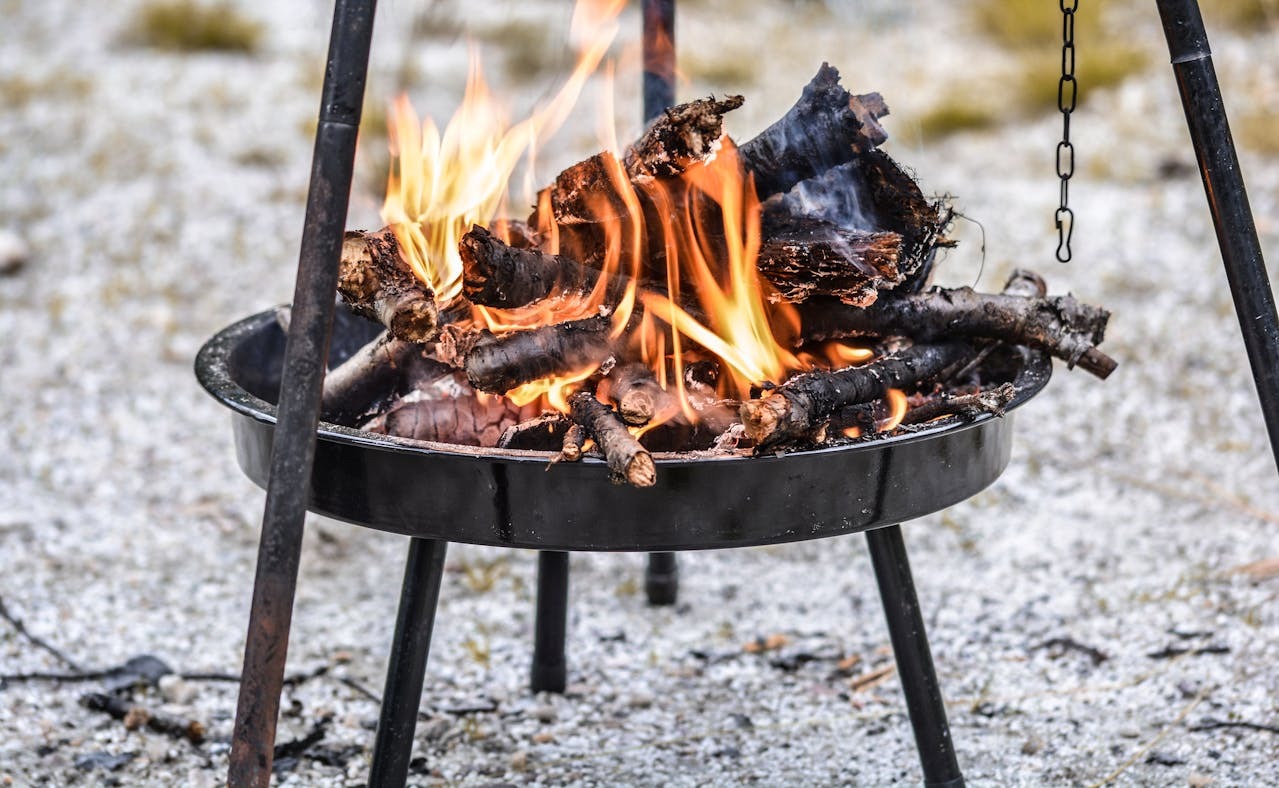 firewood burning in steel tray